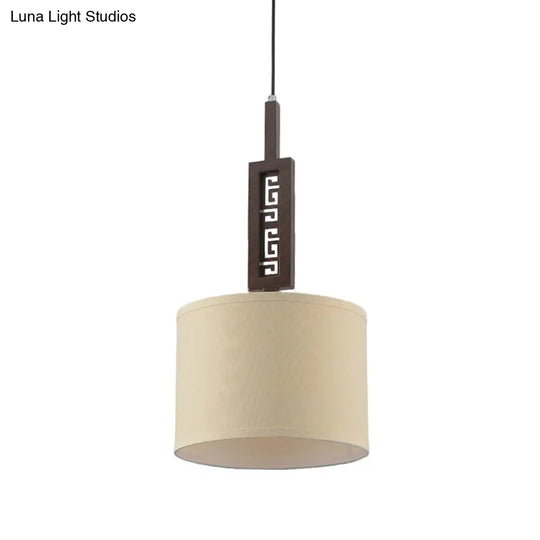 Modernist Brown Wood Hanging Lamp Kit With Carved Design Down Lighting And Drum Fabric Shade - 1