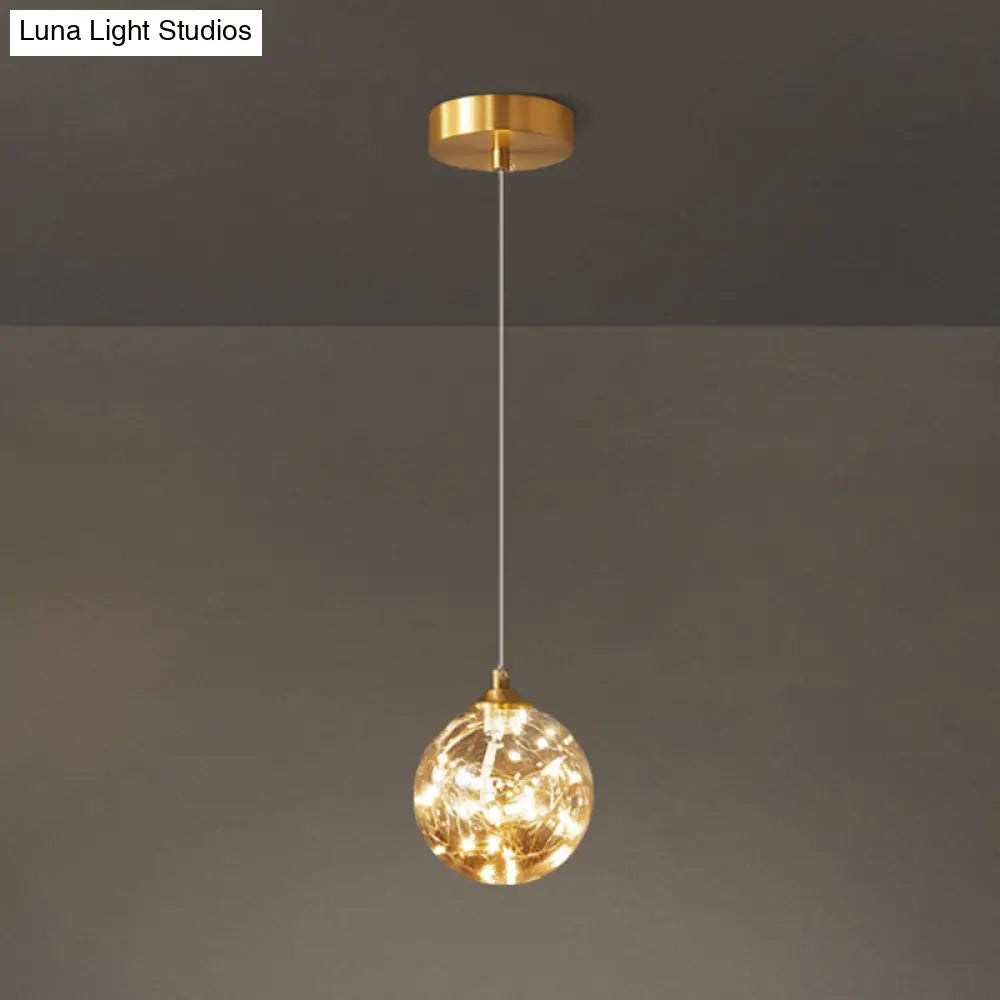 Nordic Amber Glass Led Pendant Lamp With Brass Finish And Starry Design For Bedroom