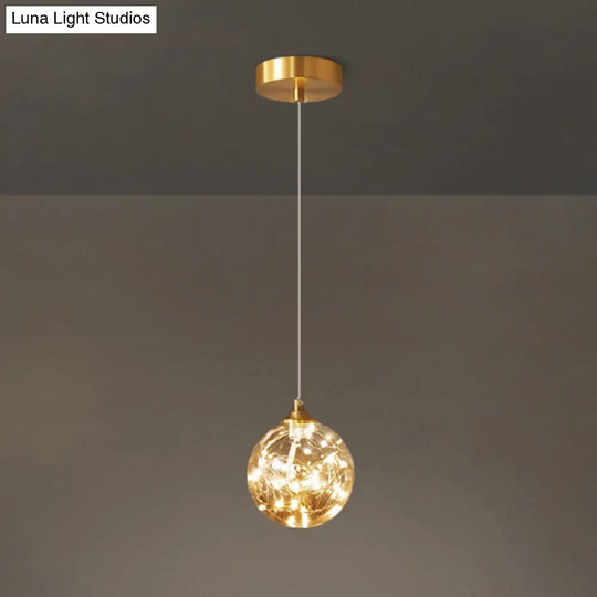 Nordic Amber Glass Led Pendant Lamp With Brass Finish And Starry Design For Bedroom