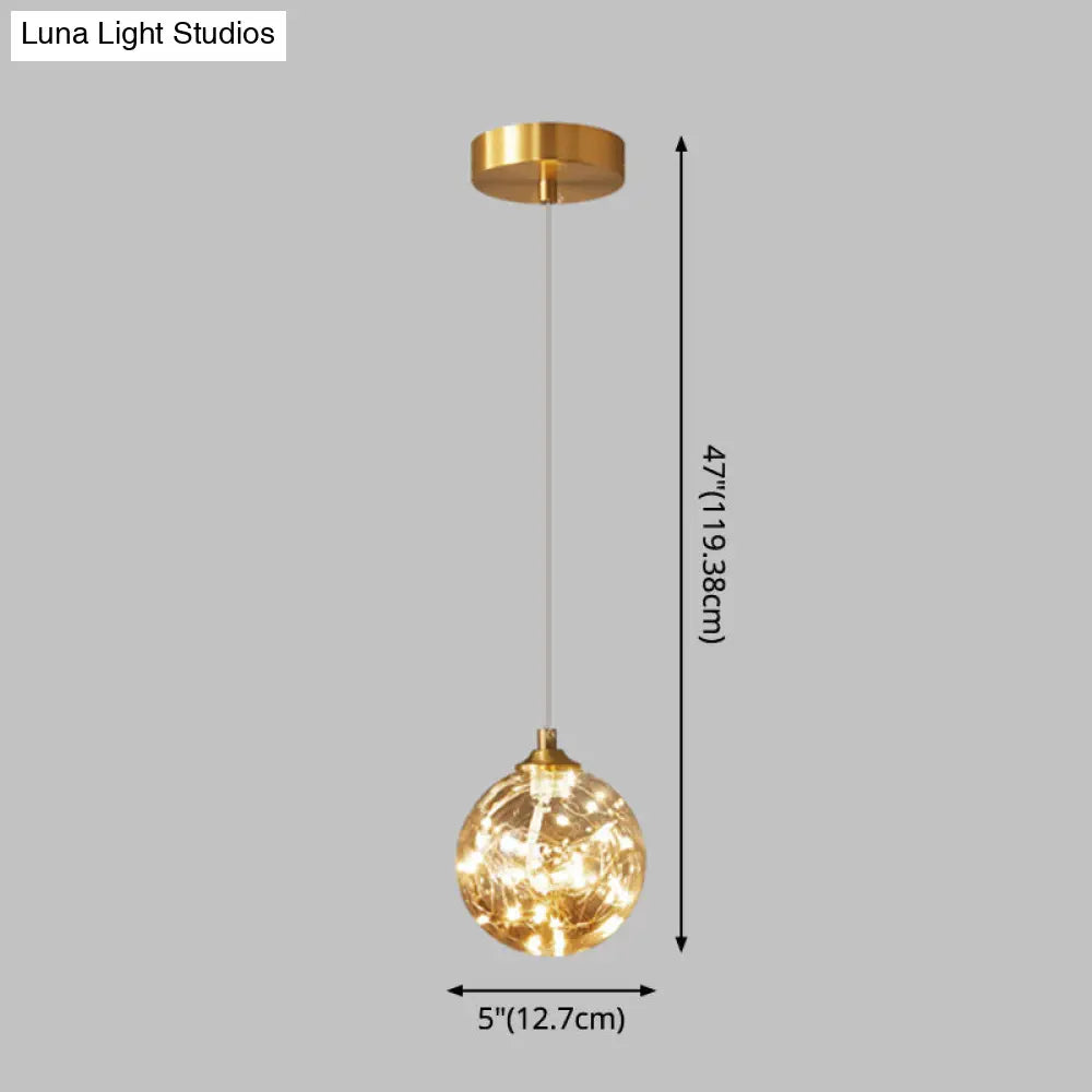 Nordic Amber Glass Led Pendant Lamp With Brass Finish And Starry Design For Bedroom