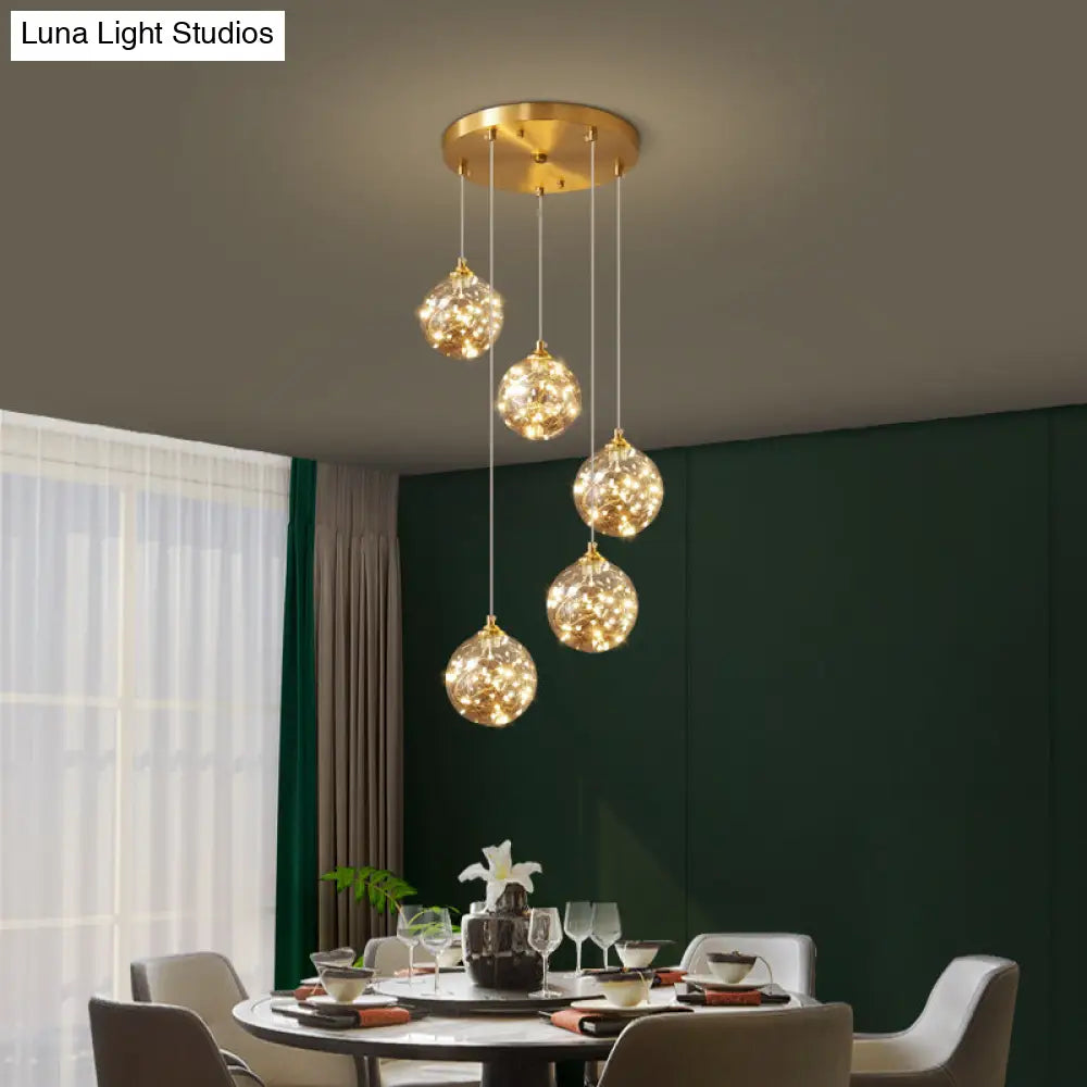 Nordic Amber Glass Led Pendant Lamp With Brass Finish And Starry Design For Bedroom