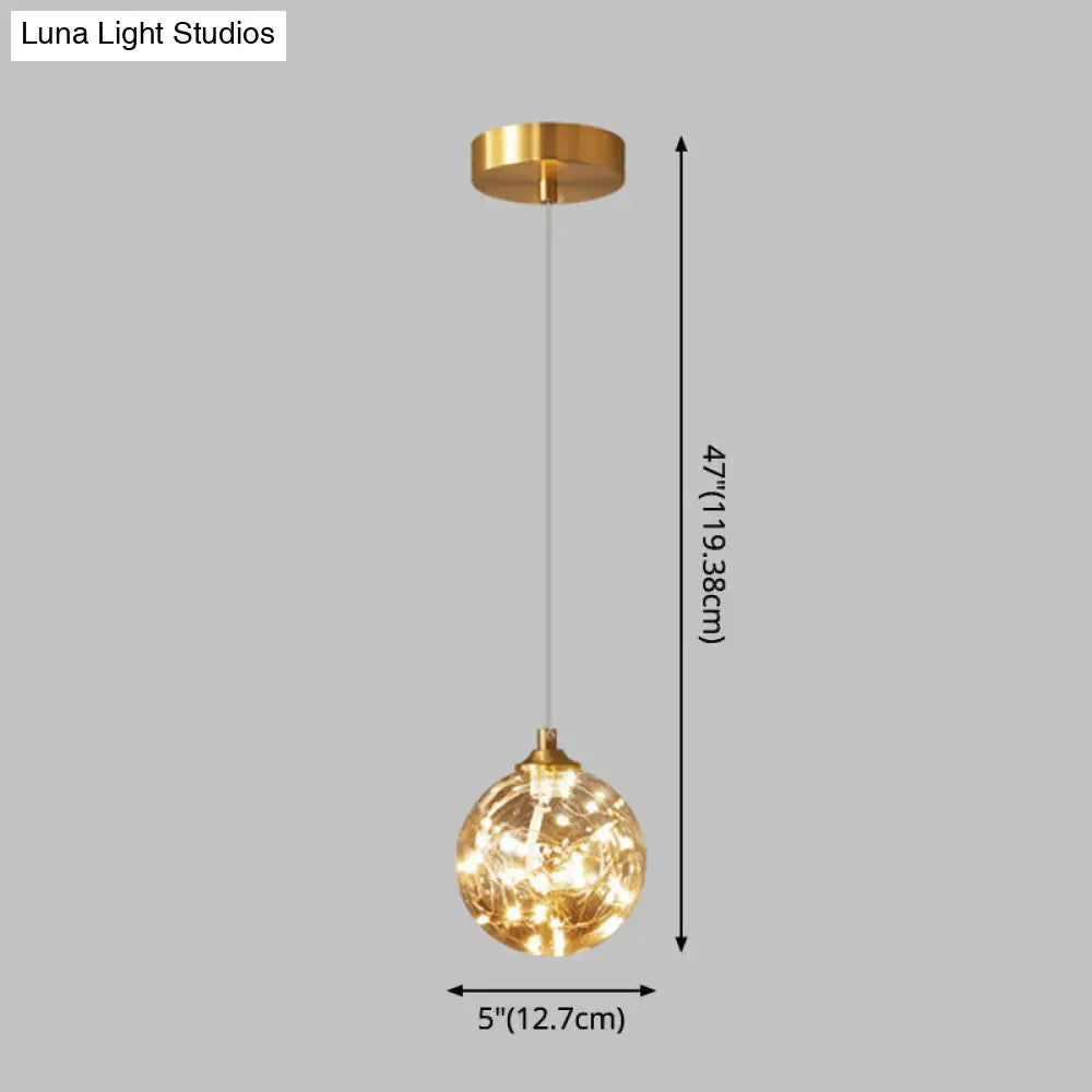 Amber Glass Led Pendant Lamp With Brass Finish - Nordic Style Lighting For Bedroom