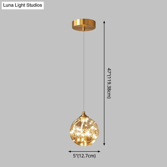 Amber Glass Led Pendant Lamp With Brass Finish - Nordic Style Lighting For Bedroom