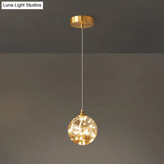 Amber Glass Led Pendant Lamp With Brass Finish - Nordic Style Lighting For Bedroom