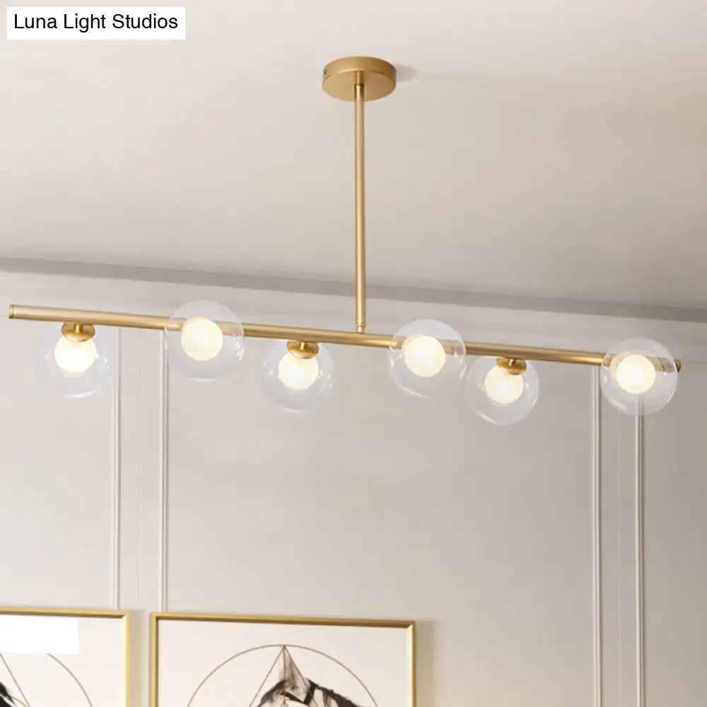 Nordic Metal 6-Head Linear Island Light With Gold Finish And Clear Glass Globes