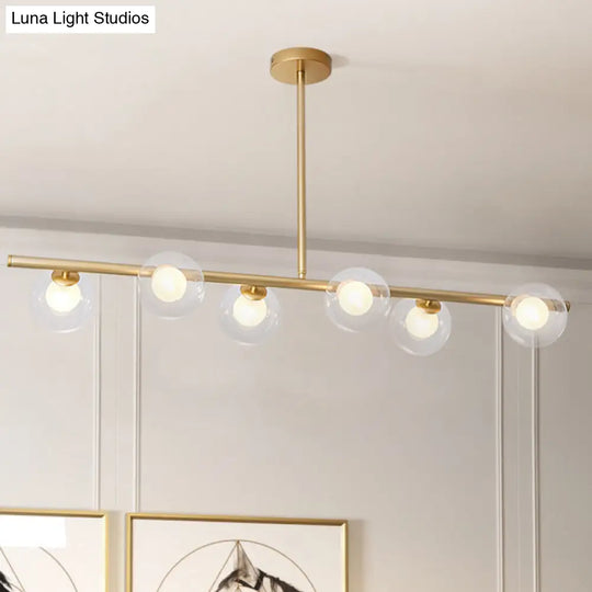 Nordic Metal 6-Head Linear Island Light With Gold Finish And Clear Glass Globes