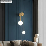 Opal Glass Ball Designer Sconce With 2 Gold Heads For Wall Mounting In Living Room