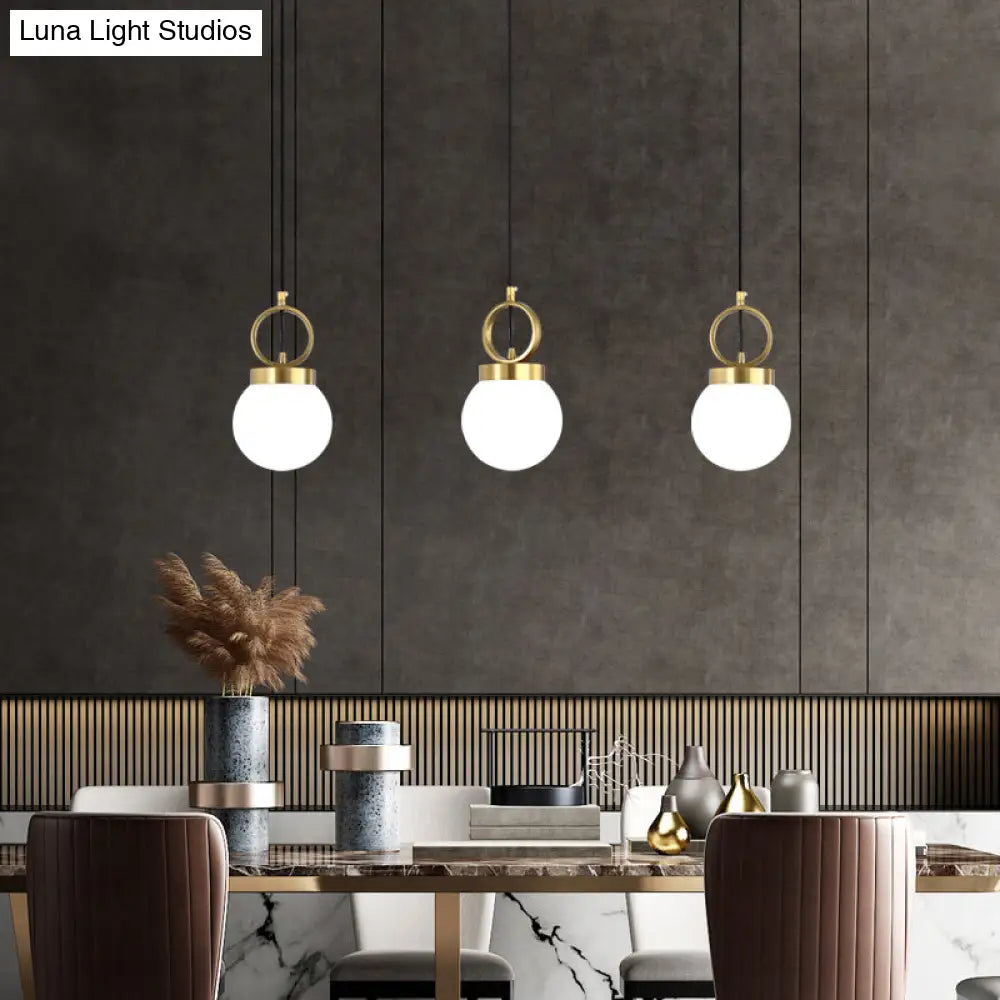 Minimalist Opal Glass Dining Room Pendant Lamp With Gold Ring Top