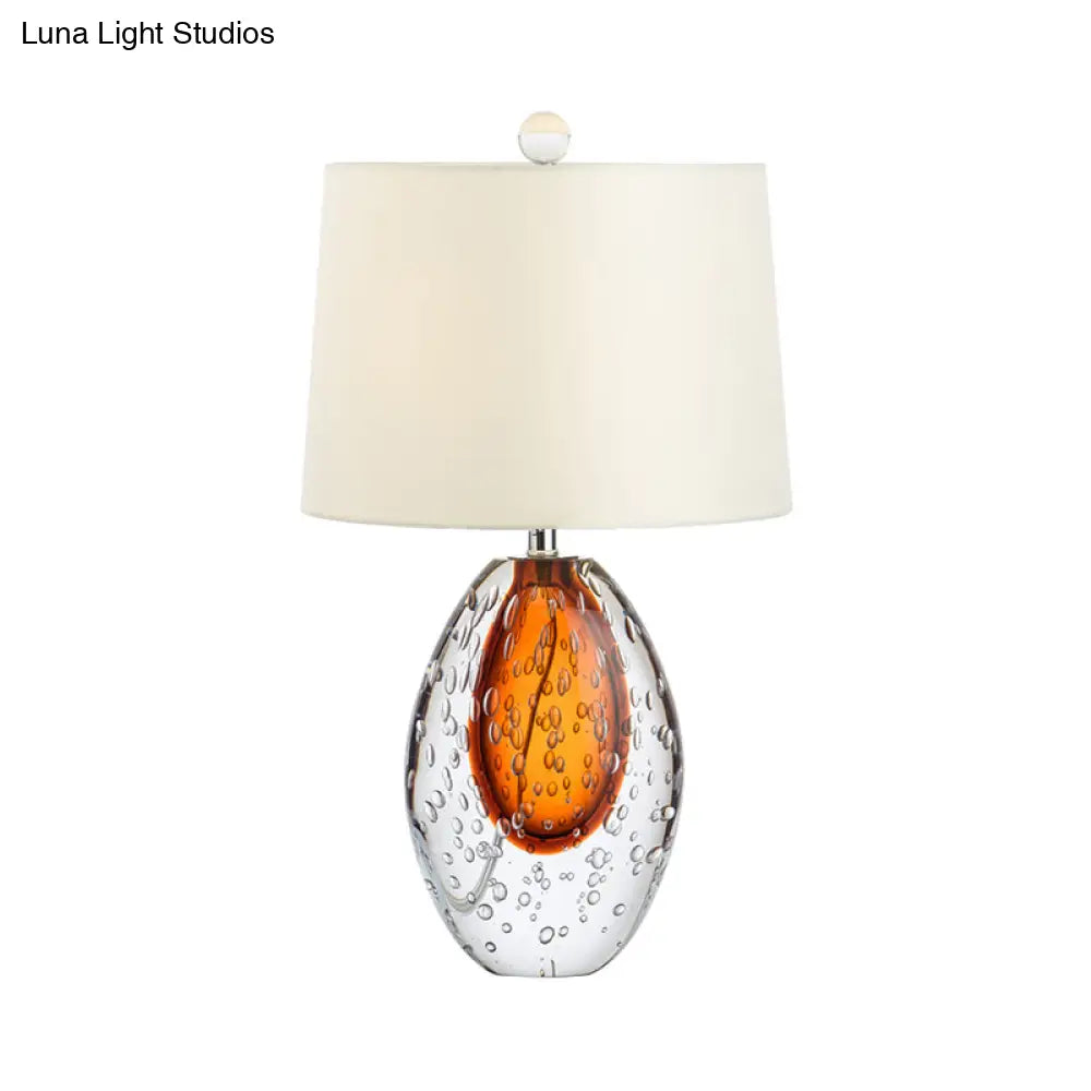 Oval Desk Lamp With Clear Bubble Glass Ideal For Bedroom Or Night Table Modern Design In White