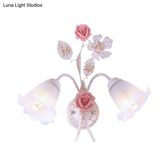 Pastoral Floral White Glass Wall Sconce With Metal Curved Arm For Living Room - 1/2-Light Mount Lamp