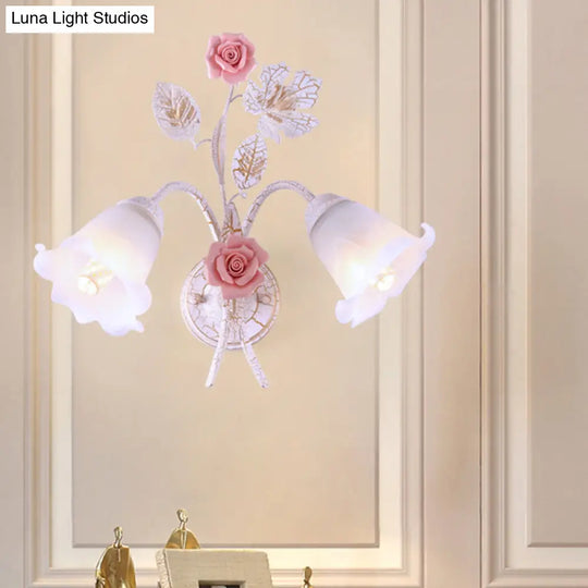 Pastoral Floral White Glass Wall Sconce With Metal Curved Arm For Living Room - 1/2-Light Mount Lamp