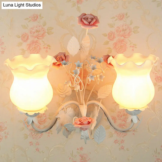 Pastoral Metal Curvy Arm Bedroom Sconce Light: 2-Head Flower Wall Lighting Fixture