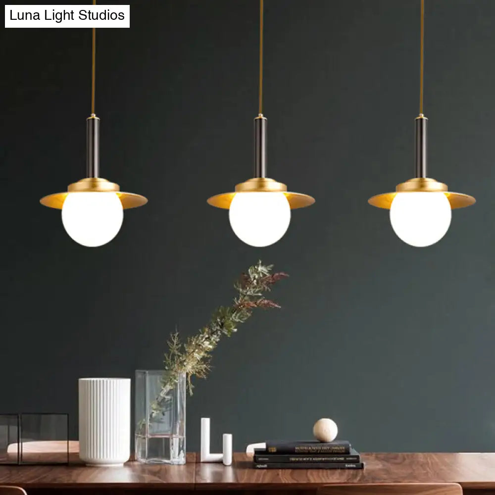 Post-Modern Metal Cap Pendant Light With Brass Head And Glass Shade