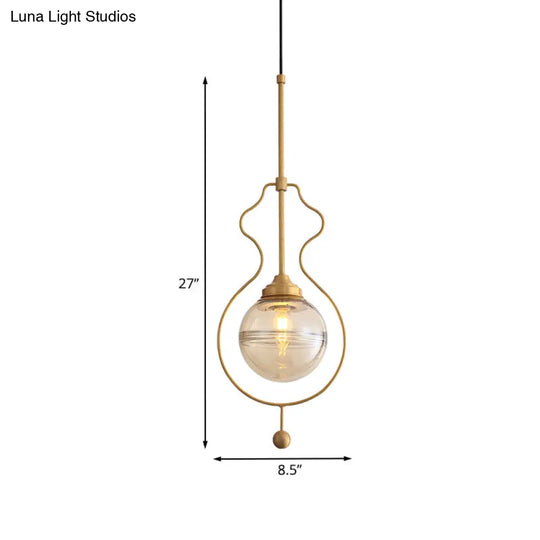 Postmodern 1-Light Clear Glass Ball Pendant Light With Ground Frame In Gold