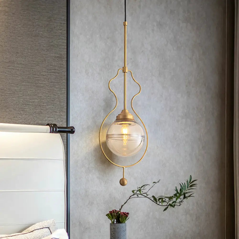 Postmodern 1-Light Clear Glass Ball Pendant Light With Ground Frame In Gold