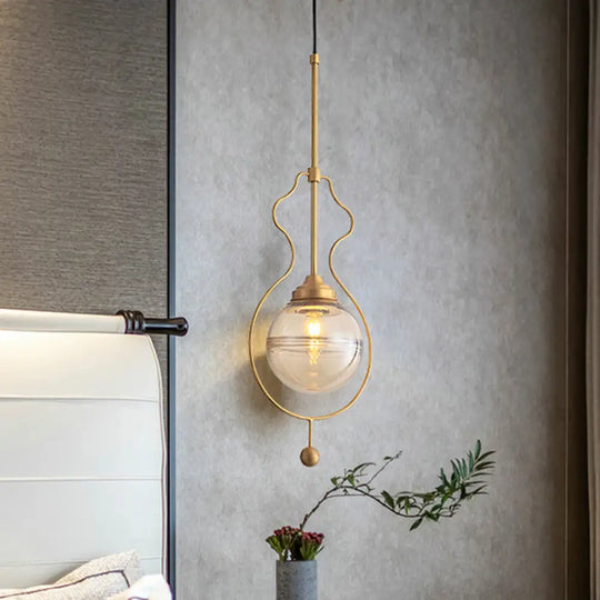 Postmodern 1-Light Clear Glass Ball Pendant Light With Ground Frame In Gold