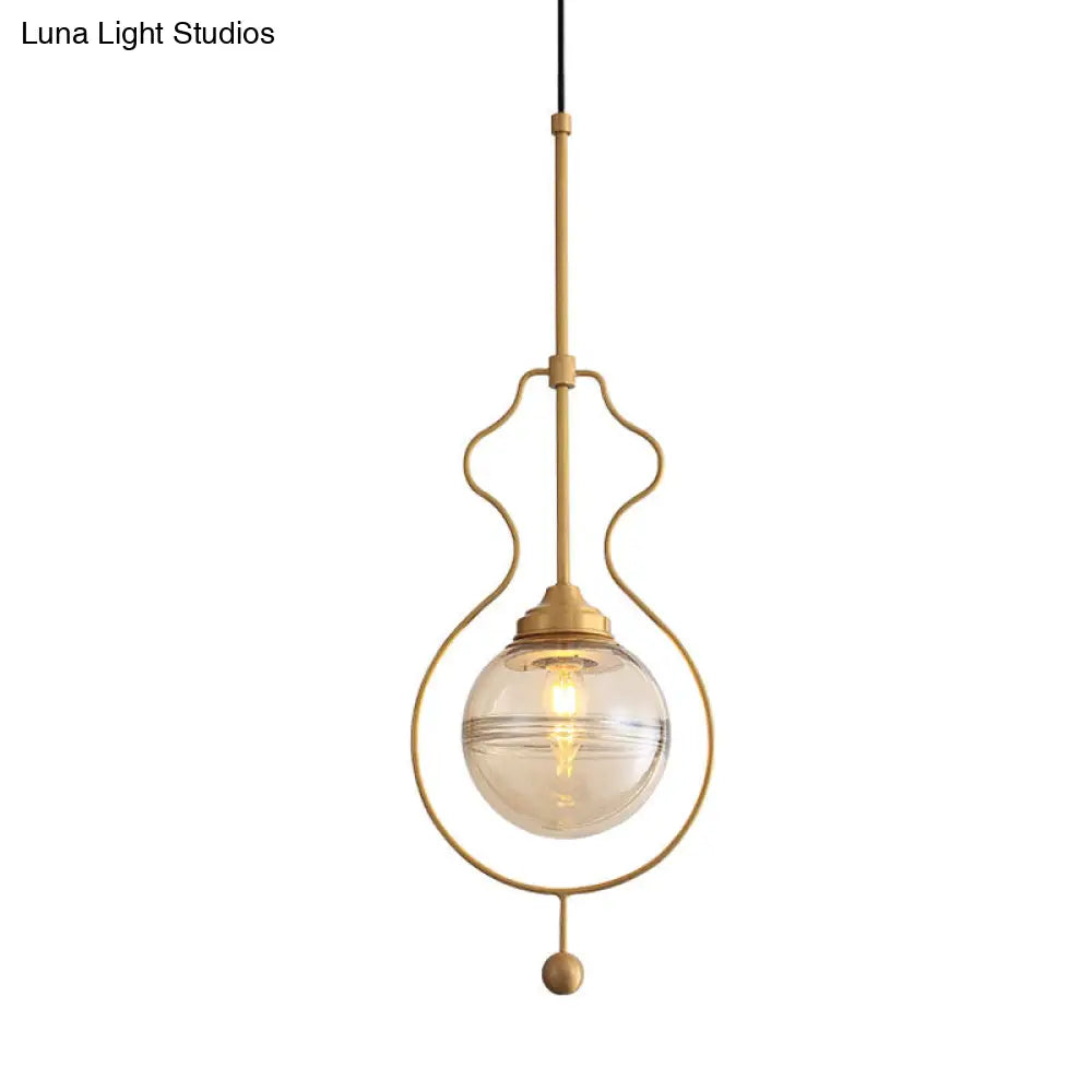 Postmodern 1-Light Clear Glass Ball Pendant Light With Ground Frame In Gold