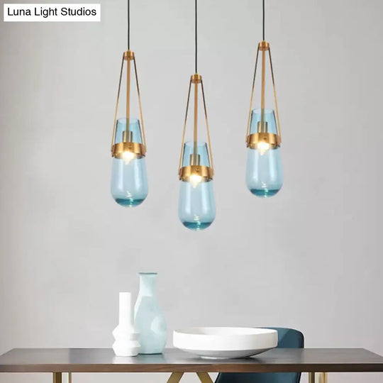 Clear/Blue Glass Pendant Lamp With Brass Gripper - Postmodern Drop Shape Dining Room Hanging Light