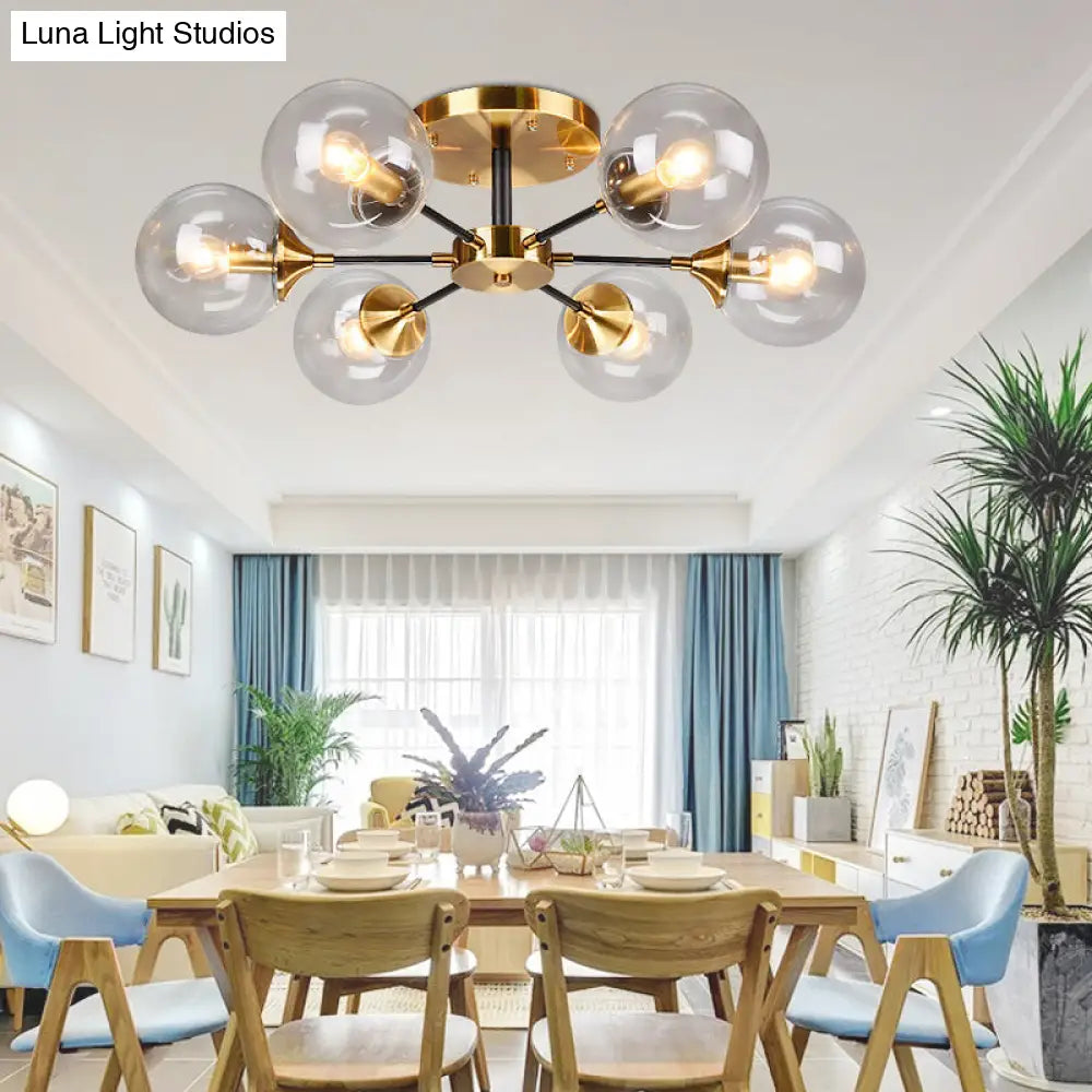 Postmodern Brass Flush Mount Light With Burst Design And Glass Ball For Living Room
