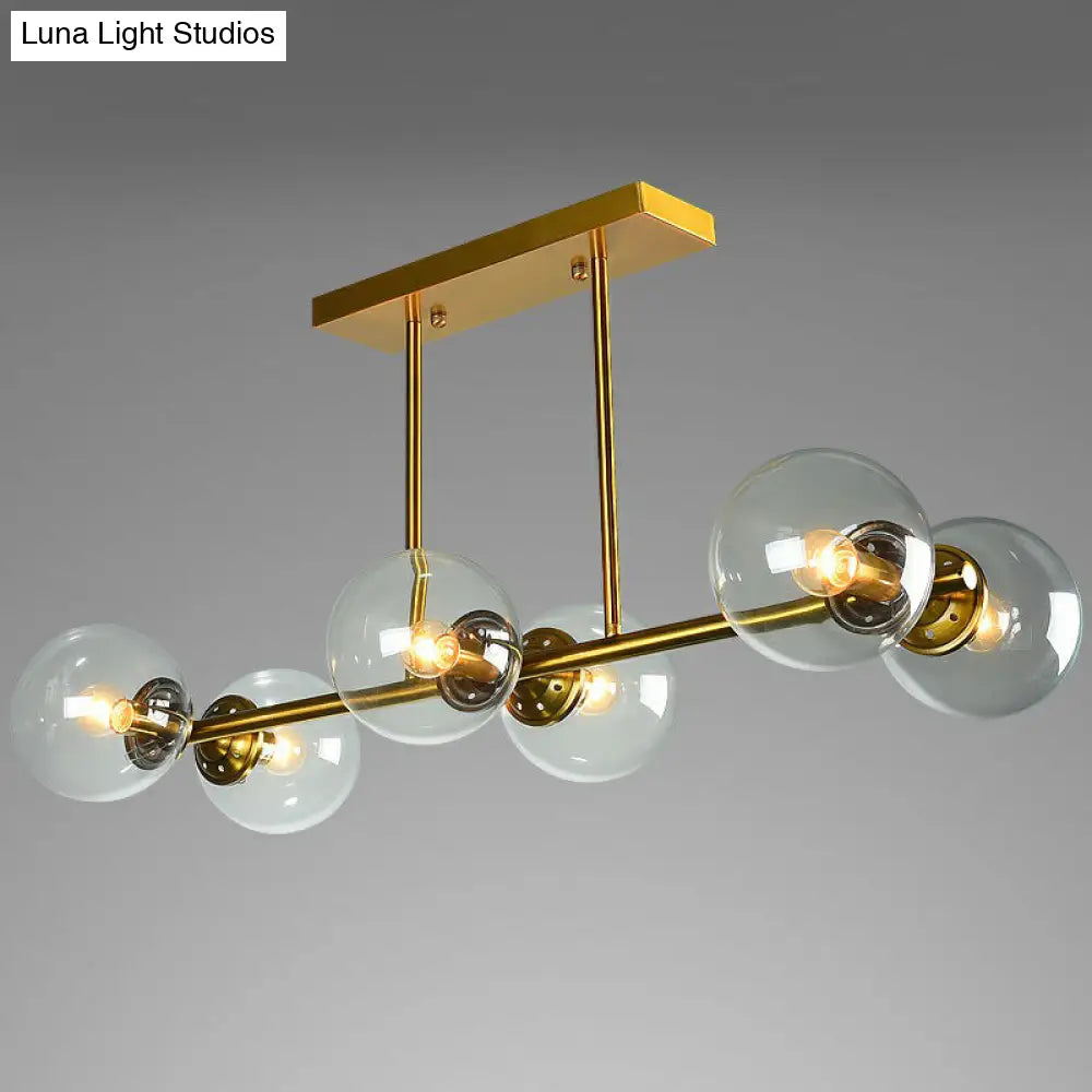 Postmodern Brass Island Light With Globe Glass Shade: Stylish Metal Ceiling Fixture