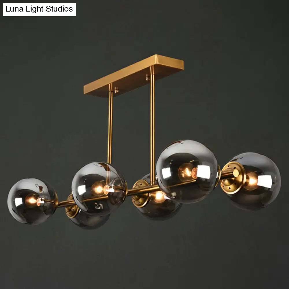 Postmodern Brass Island Light With Globe Glass Shade: Stylish Metal Ceiling Fixture