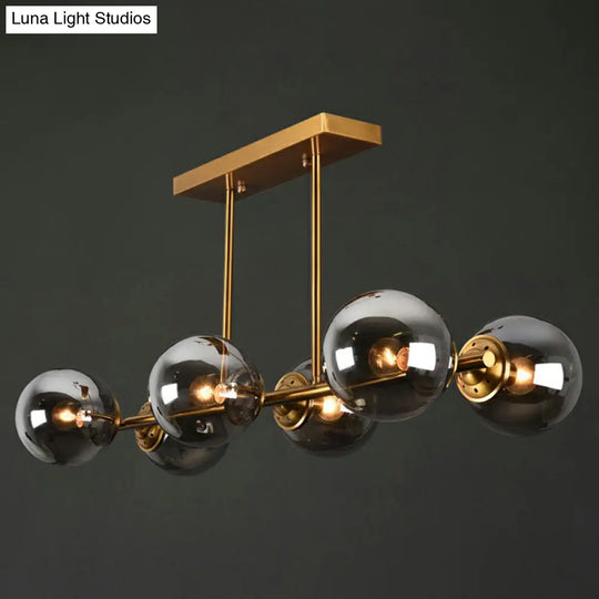 Postmodern Brass Island Light With Globe Glass Shade: Stylish Metal Ceiling Fixture