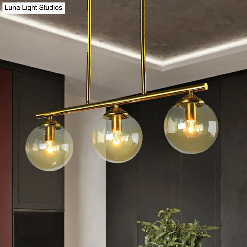 Postmodern Brass Island Light With Globe Glass Shade: Stylish Metal Ceiling Fixture