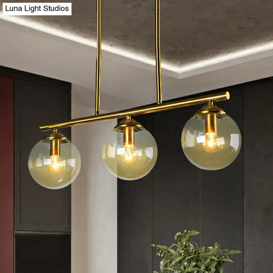 Postmodern Brass Island Light With Globe Glass Shade: Stylish Metal Ceiling Fixture