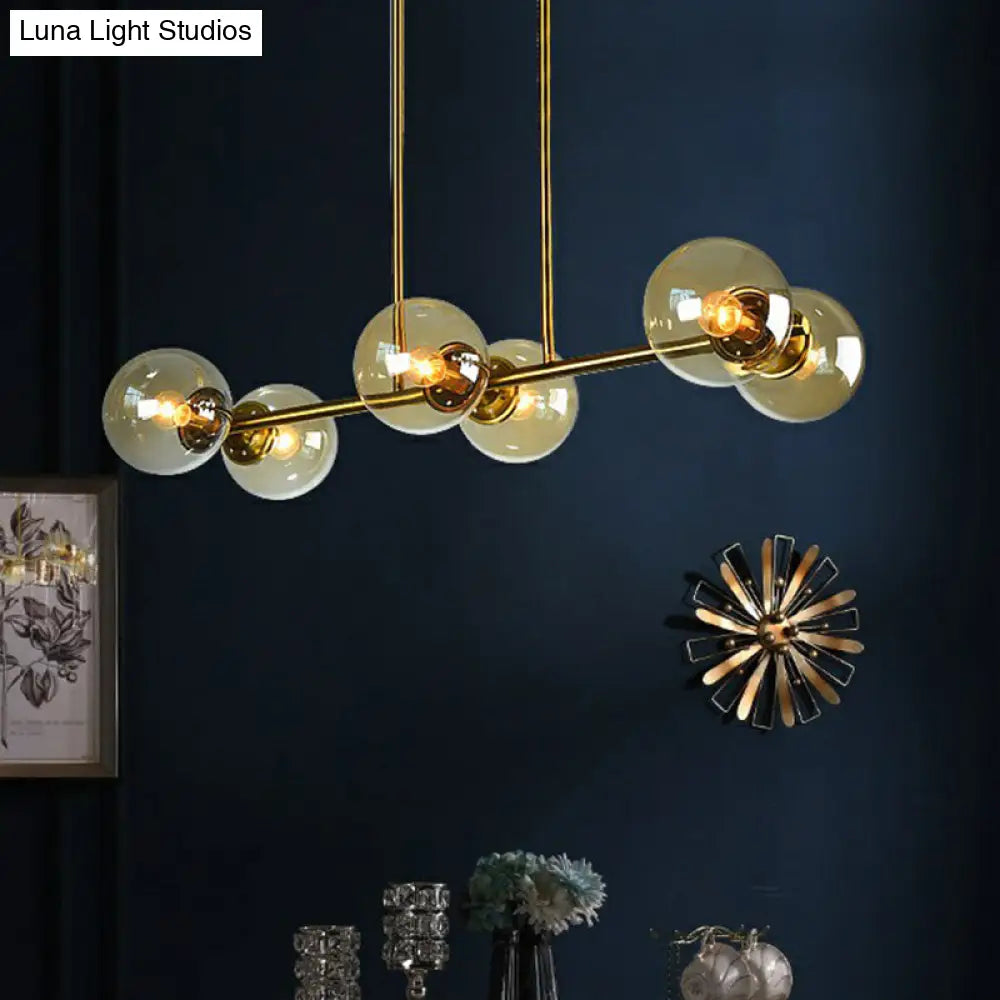 Postmodern Brass Island Light With Globe Glass Shade: Stylish Metal Ceiling Fixture