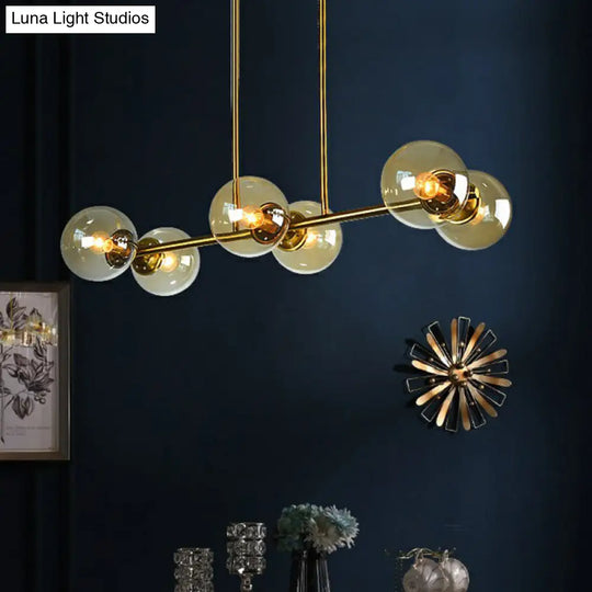 Postmodern Brass Island Light With Globe Glass Shade: Stylish Metal Ceiling Fixture