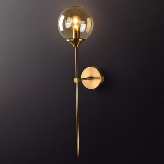 Postmodern Brass Pencil Arm Wall Lamp Sconce With Ball Glass Shade Amber