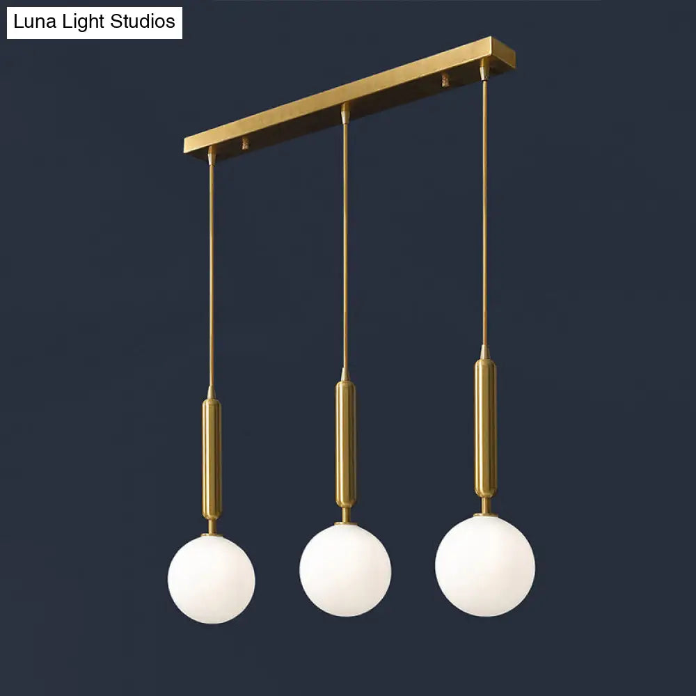 Postmodern Brass Pendant With Ball Glass Shades - Stylish 3-Light Ceiling Fixture For Dining Rooms