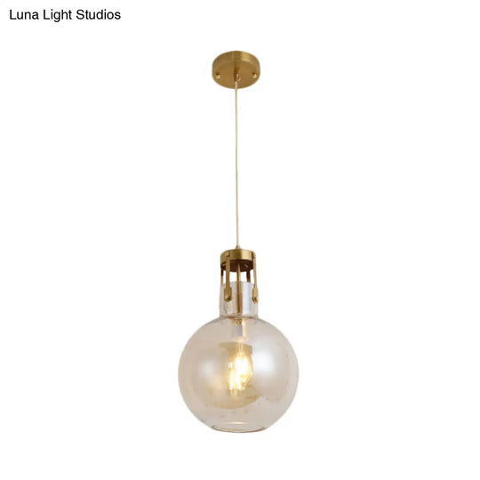 Postmodern Brass Pendant Lamp With Cognac Glass Shade - Bedside Lighting Solution