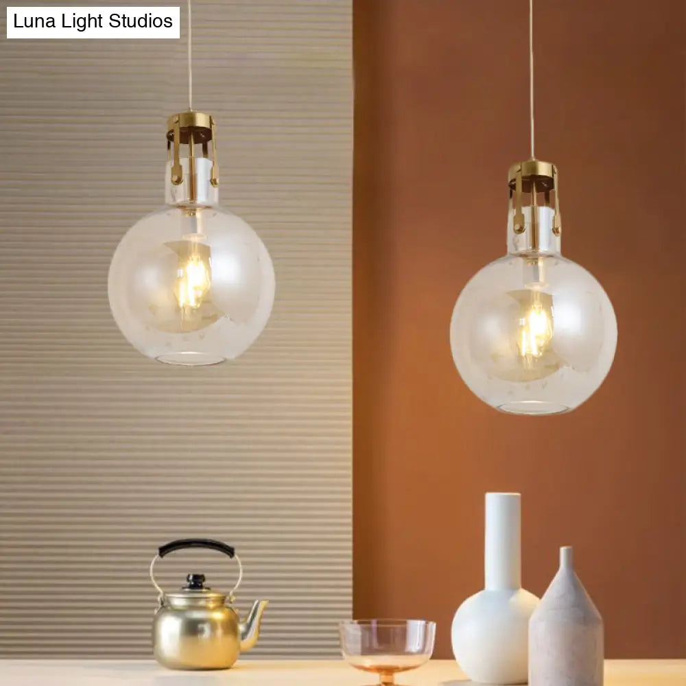 Postmodern Brass Pendant Lamp With Cognac Glass Shade - Bedside Lighting Solution