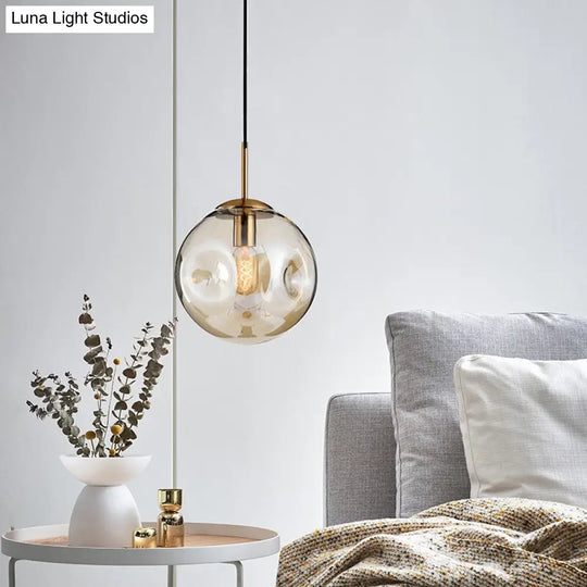 Postmodern Brass Pendant Lamp With Dimpled Glass Globe For Bedroom