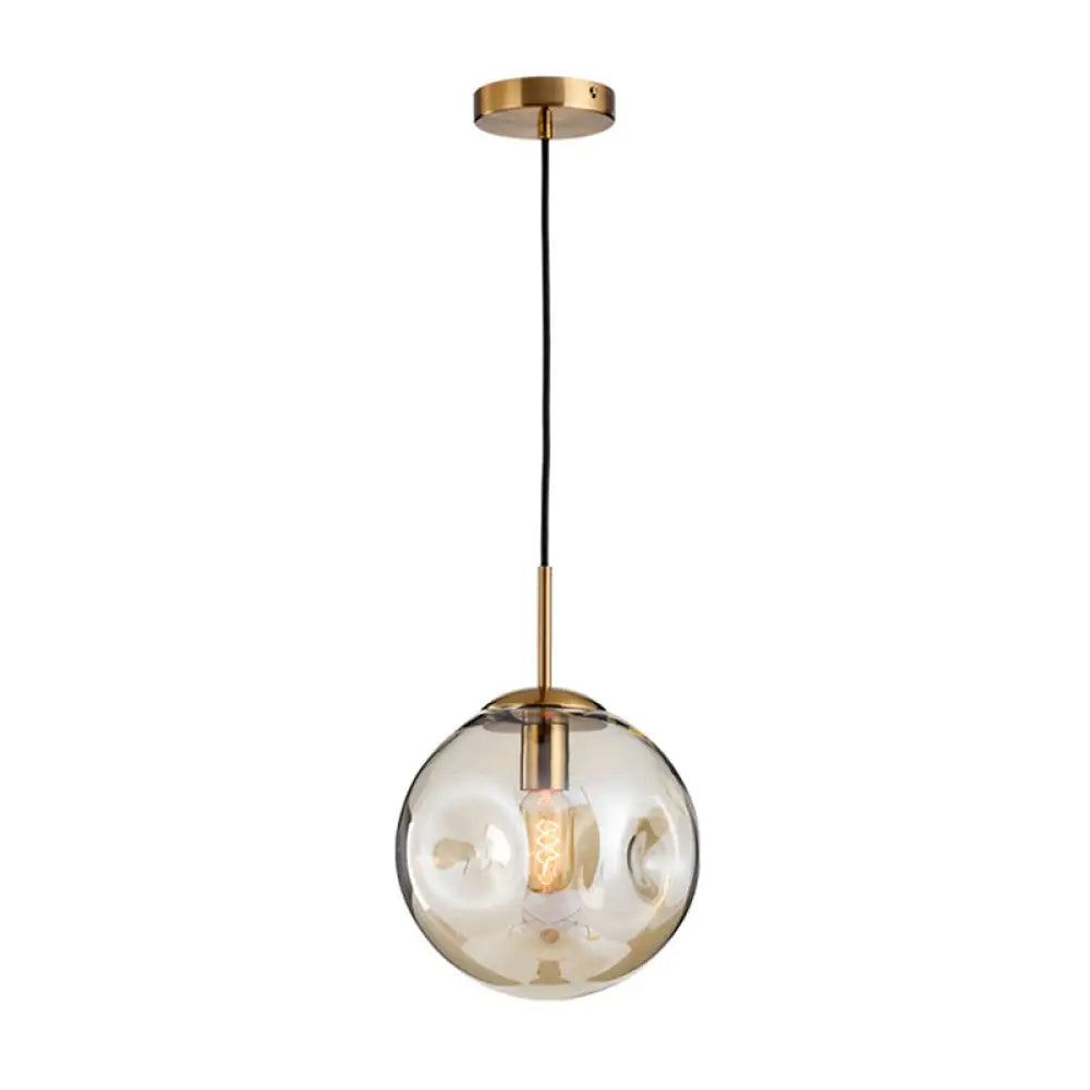 Postmodern Brass Pendant Lamp With Dimpled Glass Globe For Bedroom Cognac