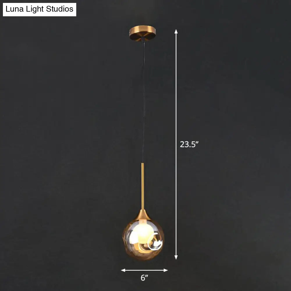 Postmodern Brass Ceiling Lamp: 1-Head Bedside Pendant Light With Glass Shade Amber