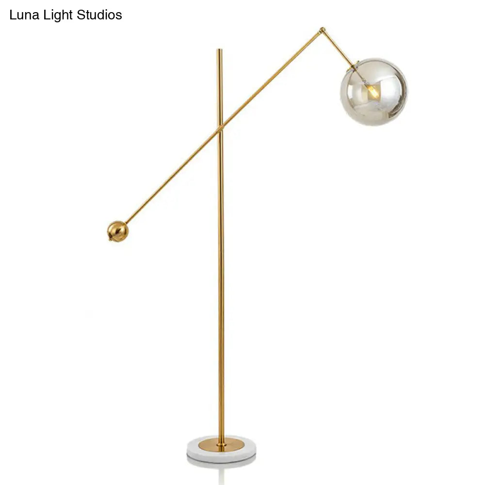 Postmodern Brass Plated Balance Arm Floor Lamp With Glass Spherical Shade - Stylish Metal Stand-Up