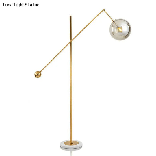 Postmodern Brass Plated Balance Arm Floor Lamp With Glass Spherical Shade - Stylish Metal Stand-Up