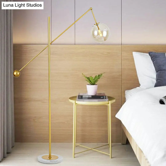 Postmodern Brass Plated Balance Arm Floor Lamp With Glass Spherical Shade - Stylish Metal Stand-Up