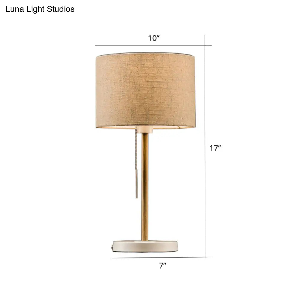 Postmodern Drum Fabric Table Light: 1-Head Beige Nightstand Lamp With Pulling Chain