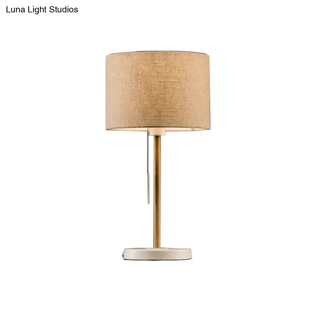 Postmodern Drum Fabric Table Light: 1-Head Beige Nightstand Lamp With Pulling Chain