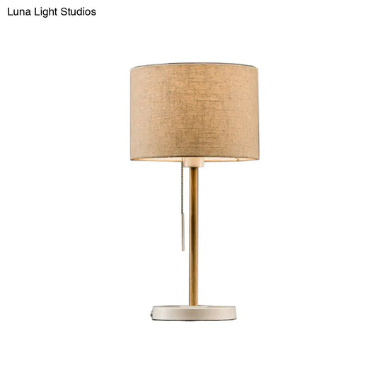 Postmodern Drum Fabric Table Light: 1-Head Beige Nightstand Lamp With Pulling Chain