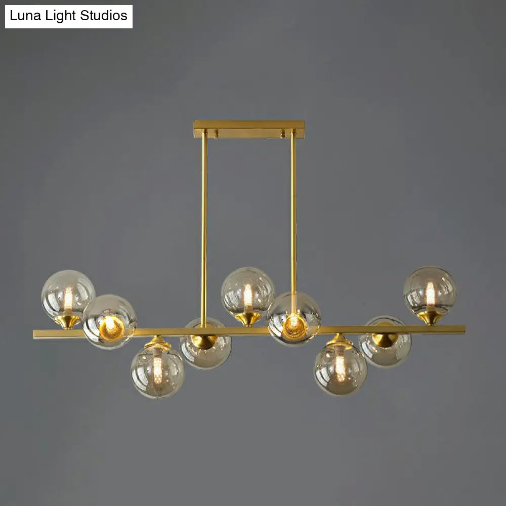 Postmodern Gold Finish Amber Glass Ball Island Hanging Lamp For Table Illumination