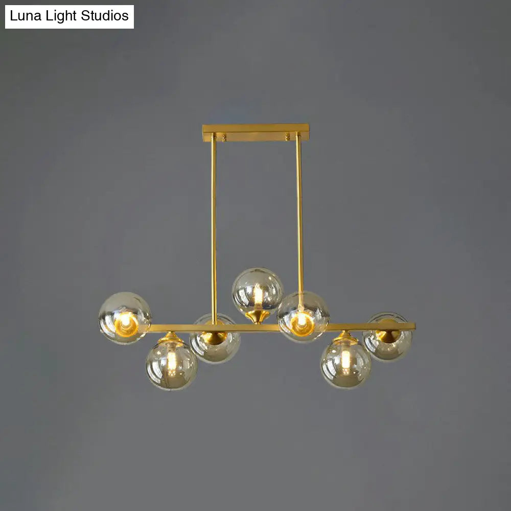 Postmodern Gold Finish Amber Glass Ball Island Hanging Lamp For Table Illumination