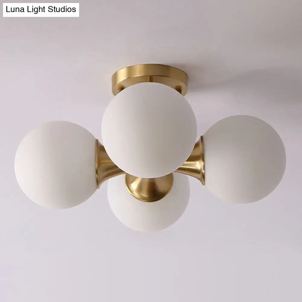 Postmodern Gold Finish Flush Mount Ceiling Light With White Glass Ball