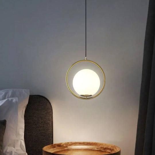 Postmodern Gold Globe Bedside Pendulum Ceiling Pendant With Cream Glass