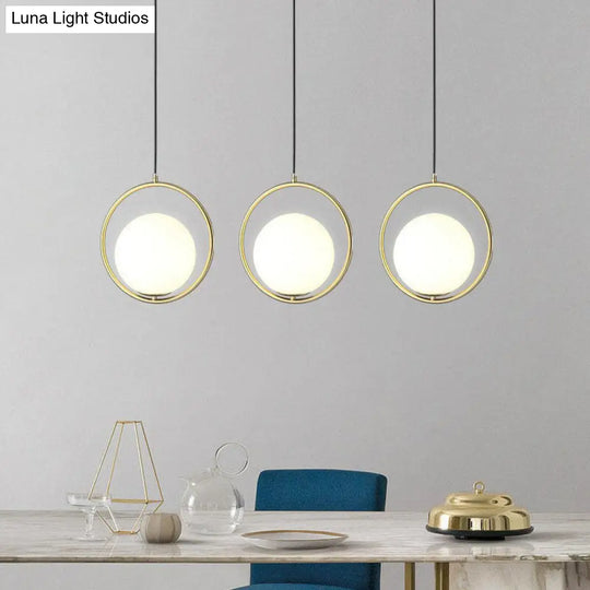 Modern Gold Ring Globe Pendant Ceiling Light With Cream Glass - Bedside Pendulum Design