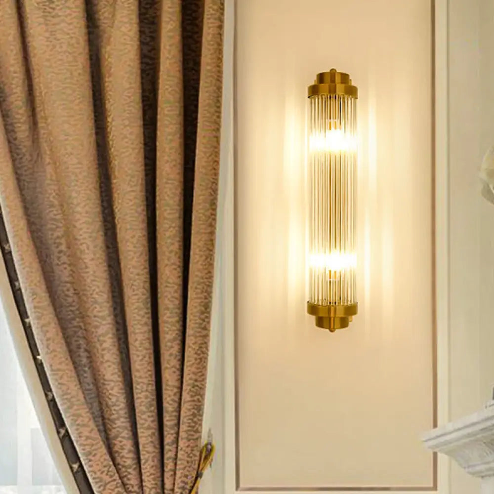 Postmodern Gold Wall Sconce With Clear Fluted Glass - 2 Lights Tubular Design