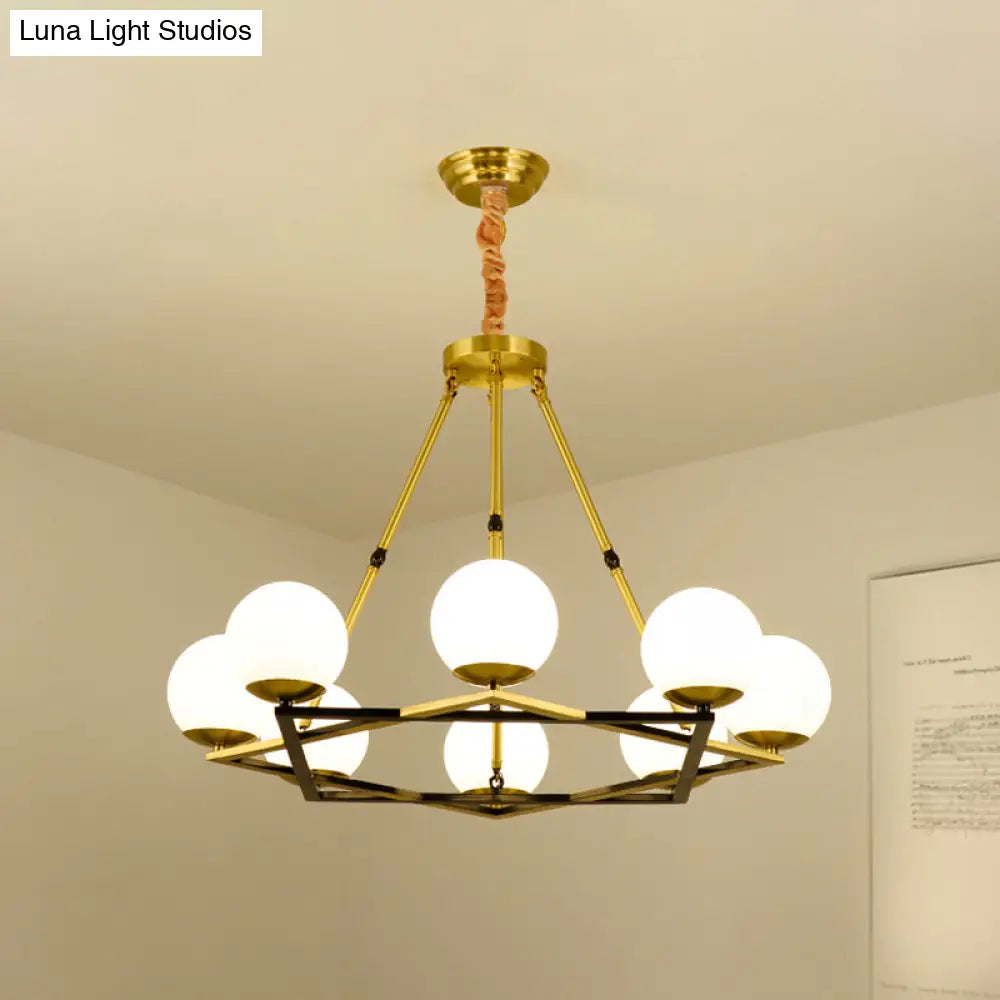 Postmodern Polygon Metal Chandelier With Brass Finish And Globe White Glass Shades